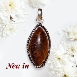 Tiger's eye pendant set in 925 silver